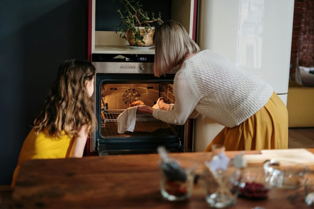 A mother and daughter baking a cake in a cozy kitchen setting, enhancing family time.